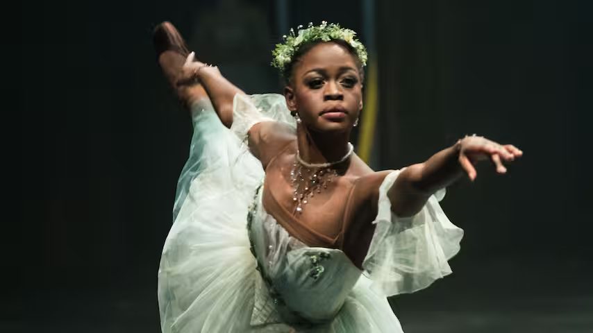 Ballerina Michaela DePrince on stage in a pale green tutu